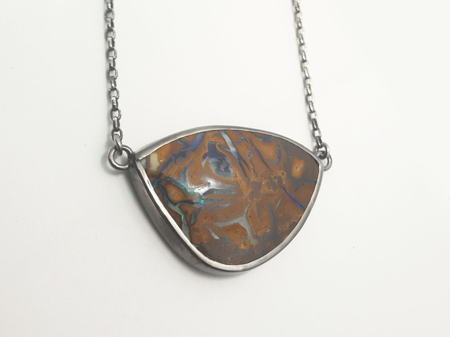 Matrix Opal set in silver frame. Locally sourced and hand crafted using ethically sourced materials. Australian designed and Australian made in coastal Queensland studio for a high quality fine fashion