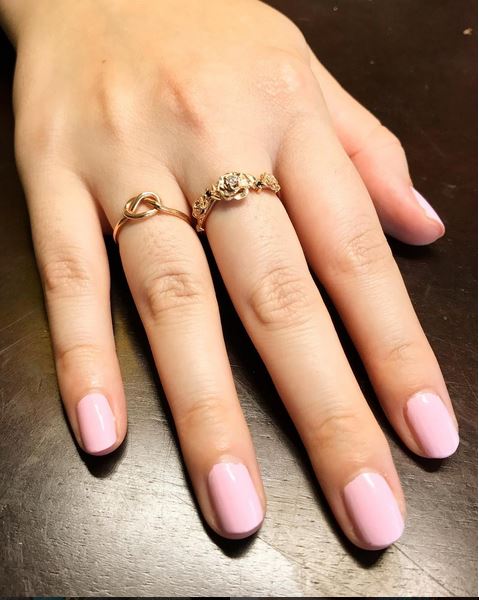 photo on hand. Rose gold ring with white diamonds and black diamonds. Set in an original design of rose and thorns. This ring is handcrafted using ethically sourced materials