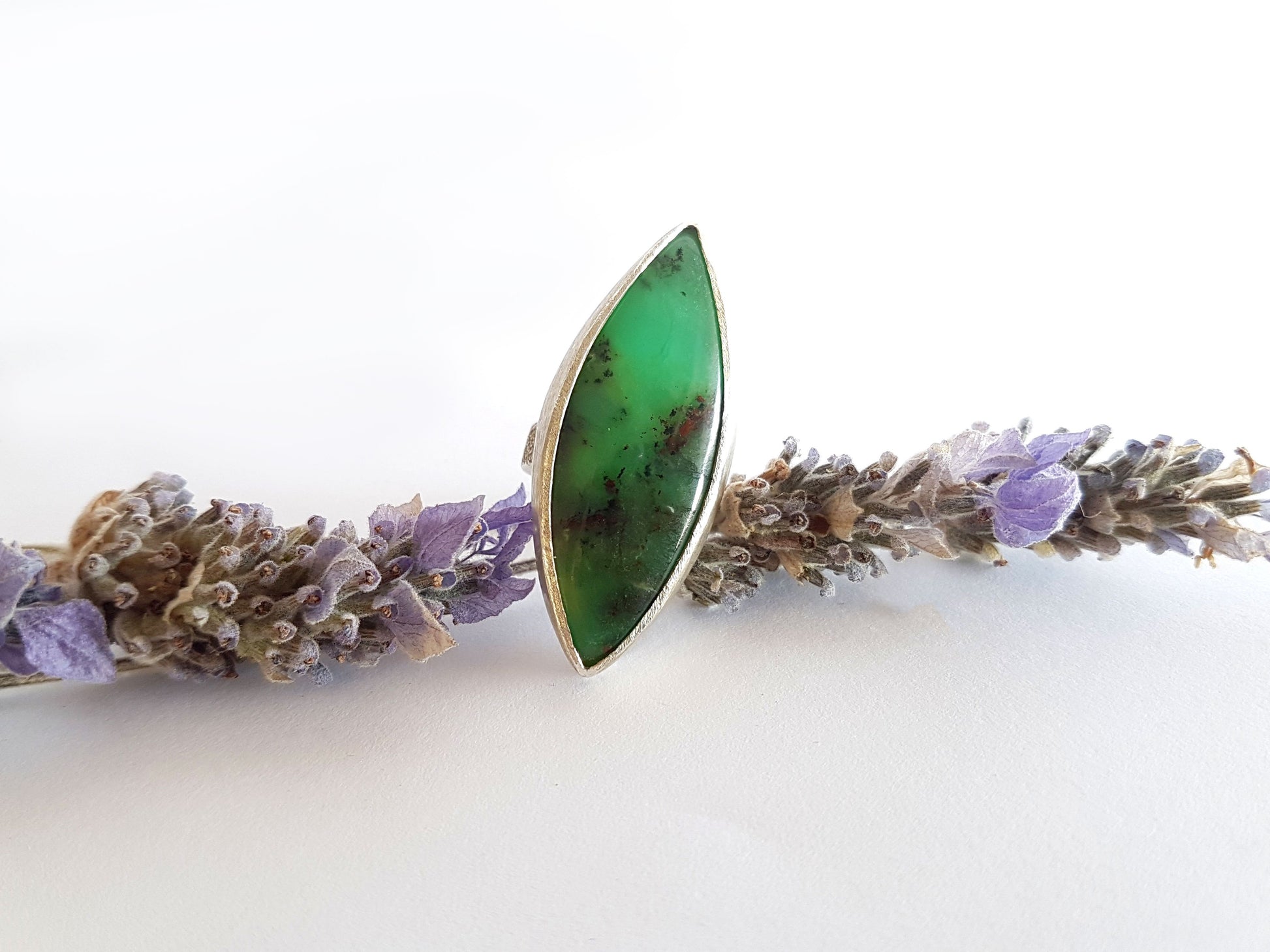 Green dendritic chrysoprase stone set in silver with a brushed and hammered finish to give texture around the stone. Australian made and hand crafted using ethical and local products.